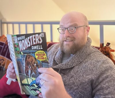Person reading spooky comic book