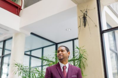 Assistant professor of arbovirology Jonathan Auguste, seen here in the Fralin Life Science Institute that houses his lab, is the only faculty member at Virginia Tech from his home country, Trinidad and Tobago. Photo by Christina Franusich for Virginia Tech.