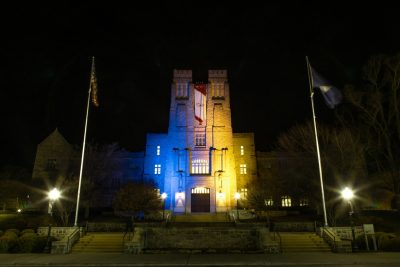 Burruss Hall was illuminated with blue and yellow in March 2022 to show solidarity with Ukraine after the Russian invasion. Photo by Christina Franusich.