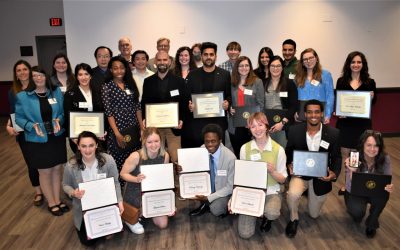 The 2023 Graduate School award winners. While several honorees could not attend the reception, College of Natural Resources and Environment master's student of the year Darby McPhail attended via phone (Dr. Marcella Kelly is holding the phone with McPhail in this photo). 